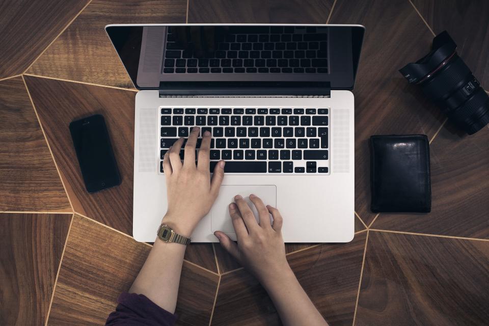 One page business website layout shown on a phone and laptop
